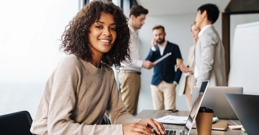 Young IT professional working from her laptop