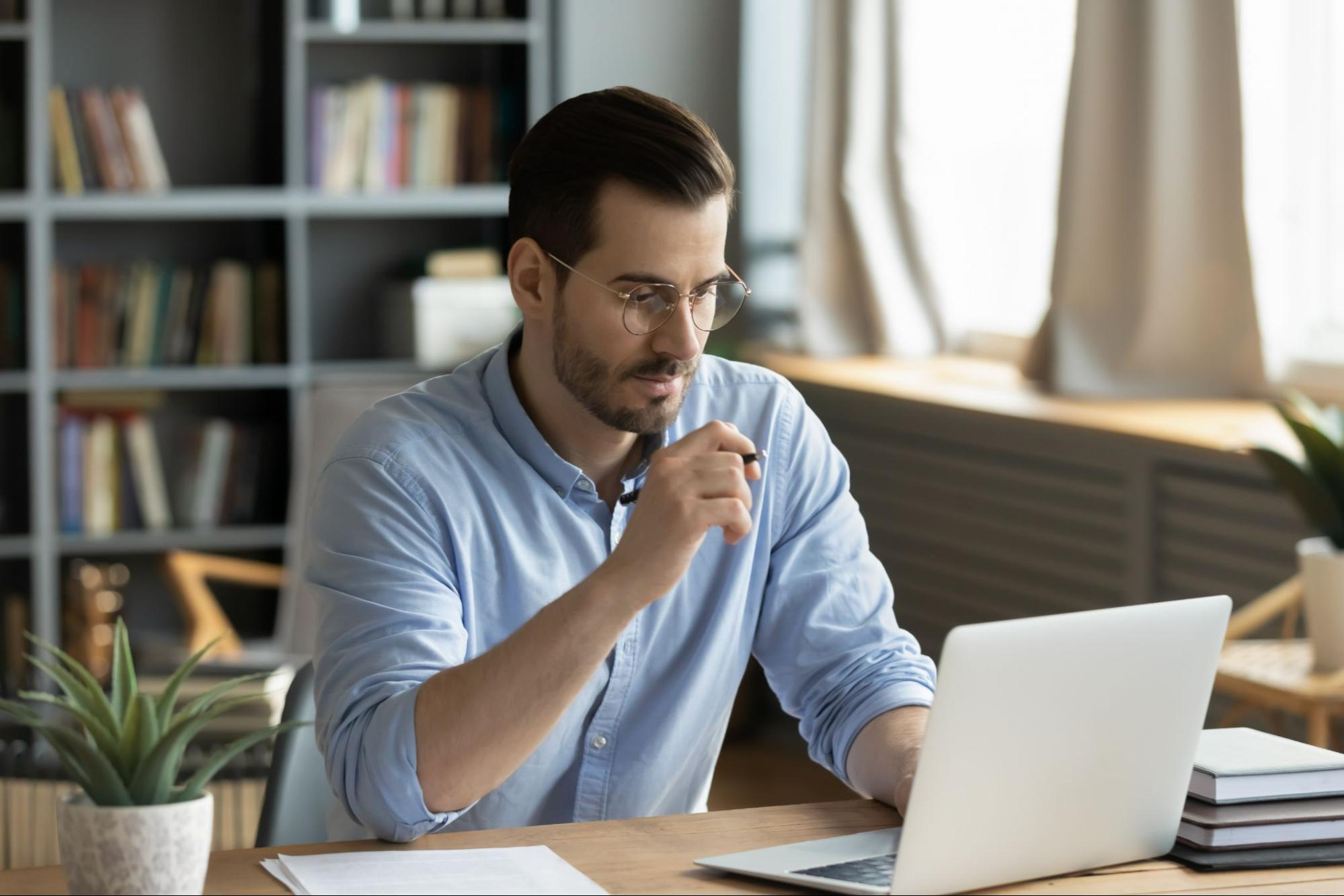 An IT worker at a laptop computer.