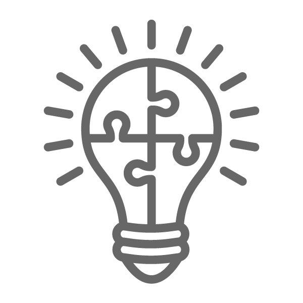 Icon of a lightbulb with jigsaw pieces inside it.